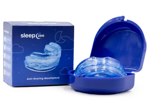 SleepZee mouthpiece in an open blue storage case beside its box